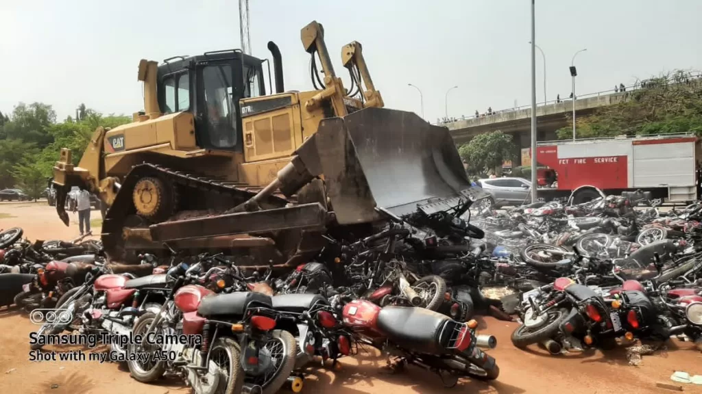 Nigerians lament as FCT Minister crush 400 motorbikes